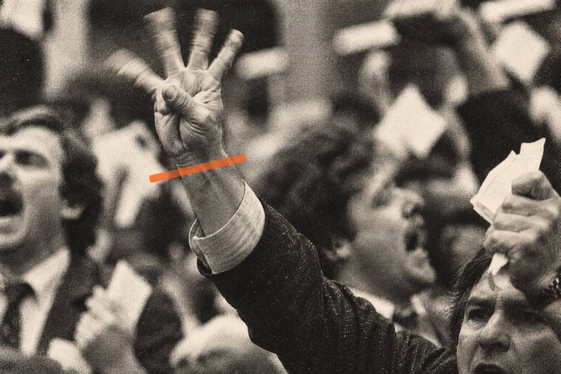 A trader watching the board mid-shout